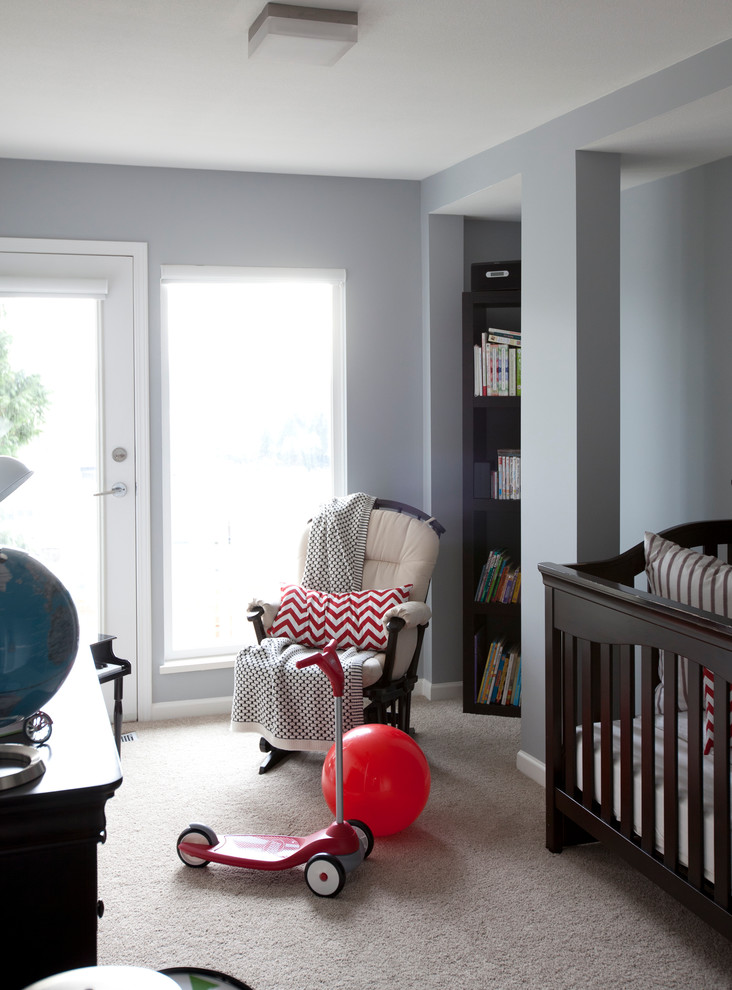 Transitional gender-neutral nursery in Vancouver with grey walls and carpet.