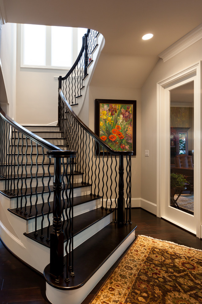 Inspiration for a traditional wood curved staircase in Houston.