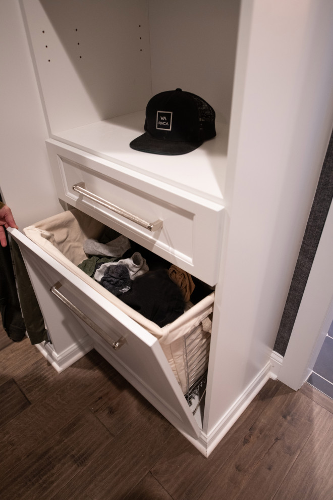 Inspiration for a large contemporary walk-in wardrobe for men in Denver with shaker cabinets, white cabinets and painted wood flooring.
