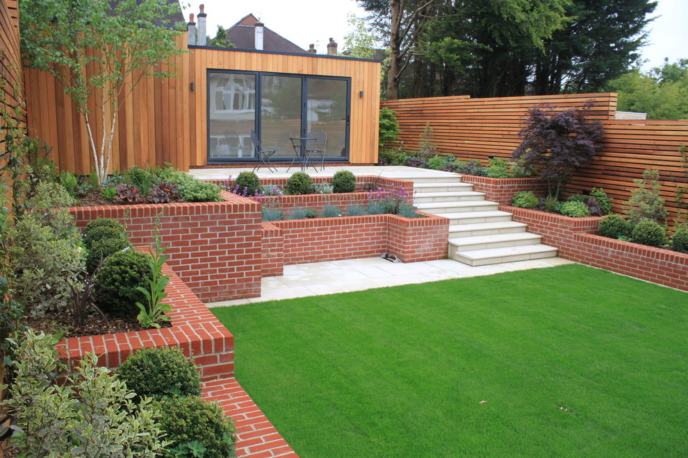 Photo of a mid-sized contemporary backyard garden in London.