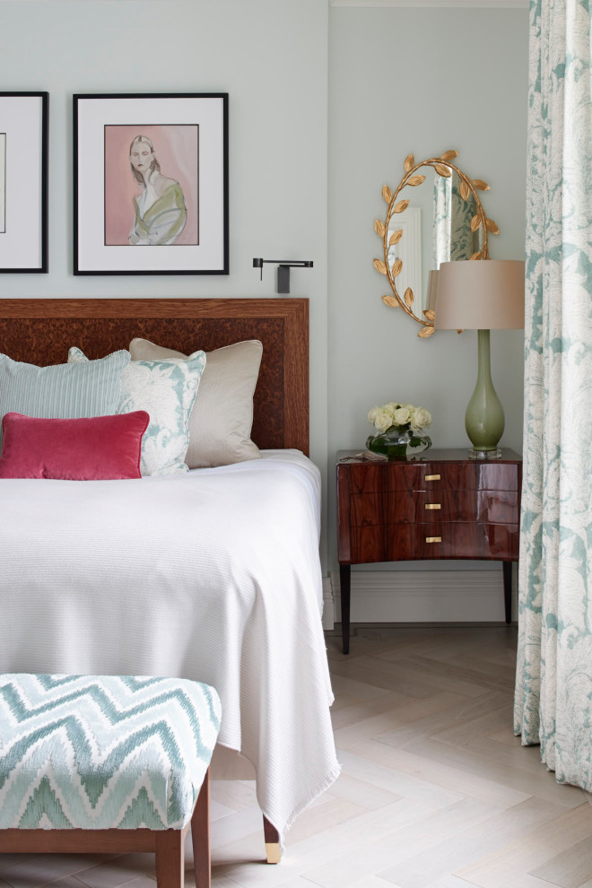 Bedroom - large transitional master medium tone wood floor and brown floor bedroom idea in London with green walls