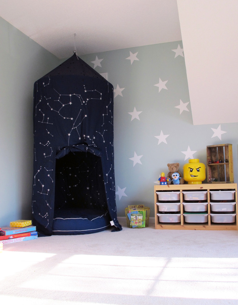 Photo of a mid-sized eclectic gender-neutral kids' playroom for kids 4-10 years old in Charlotte with carpet and multi-coloured walls.
