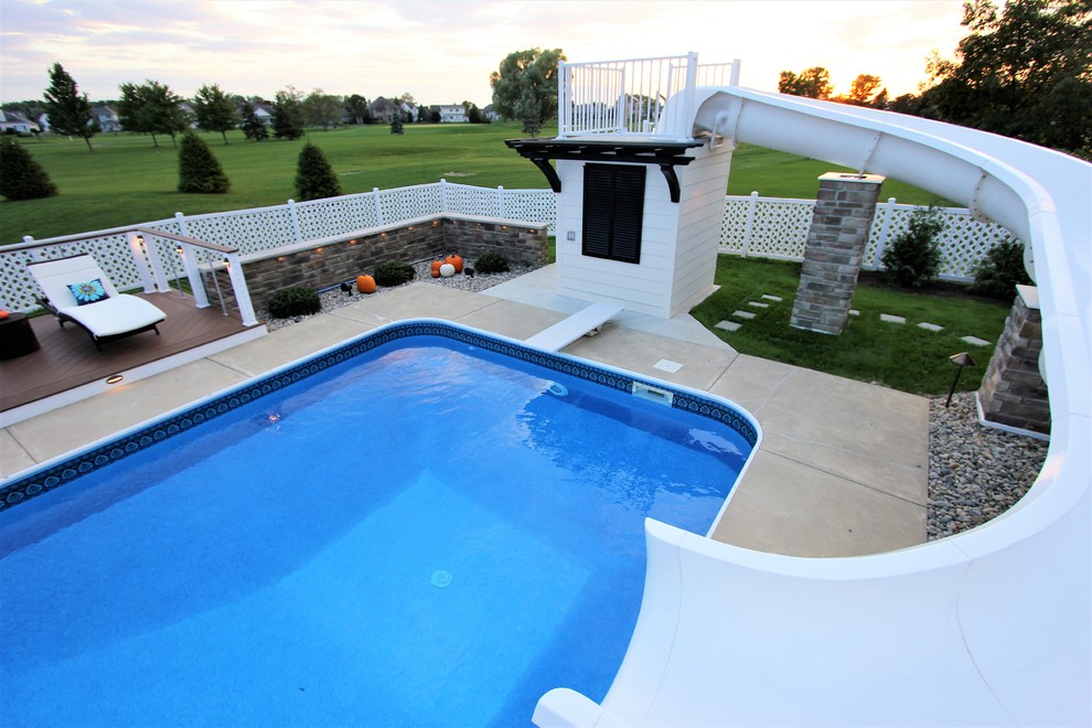 Water slide - large transitional backyard rectangular natural water slide idea with decking