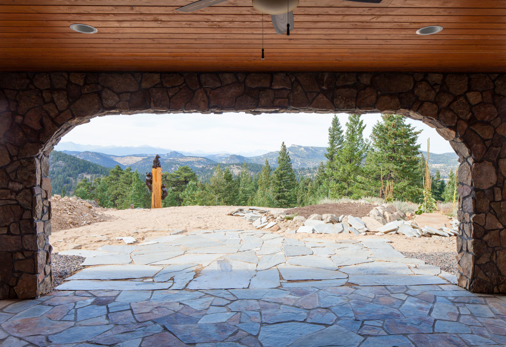 Example of a mountain style home design design in Denver