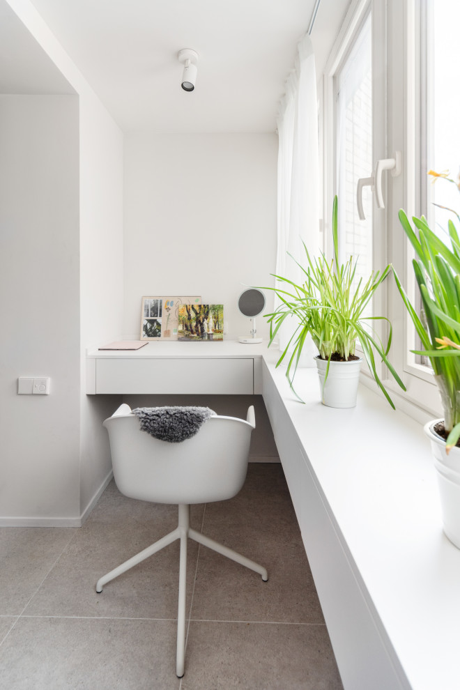 Example of a large minimalist home office design in Moscow