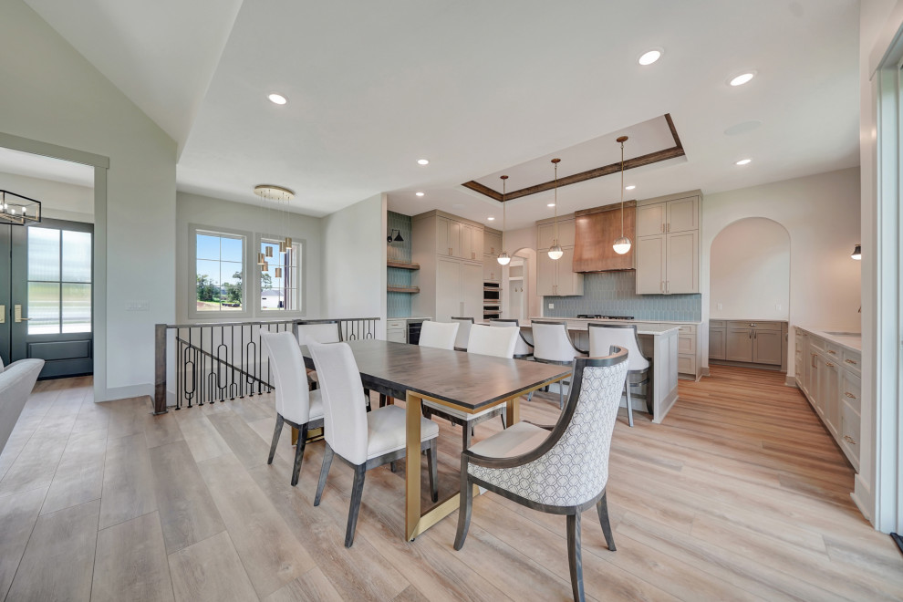 Example of a transitional dining room design in Omaha