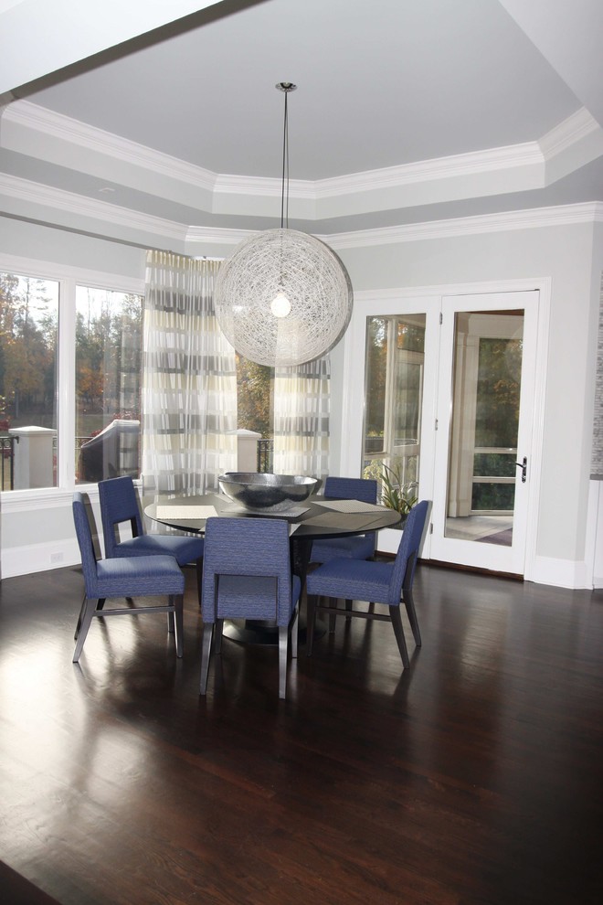 Design ideas for a contemporary dining room in Other with grey walls and dark hardwood floors.