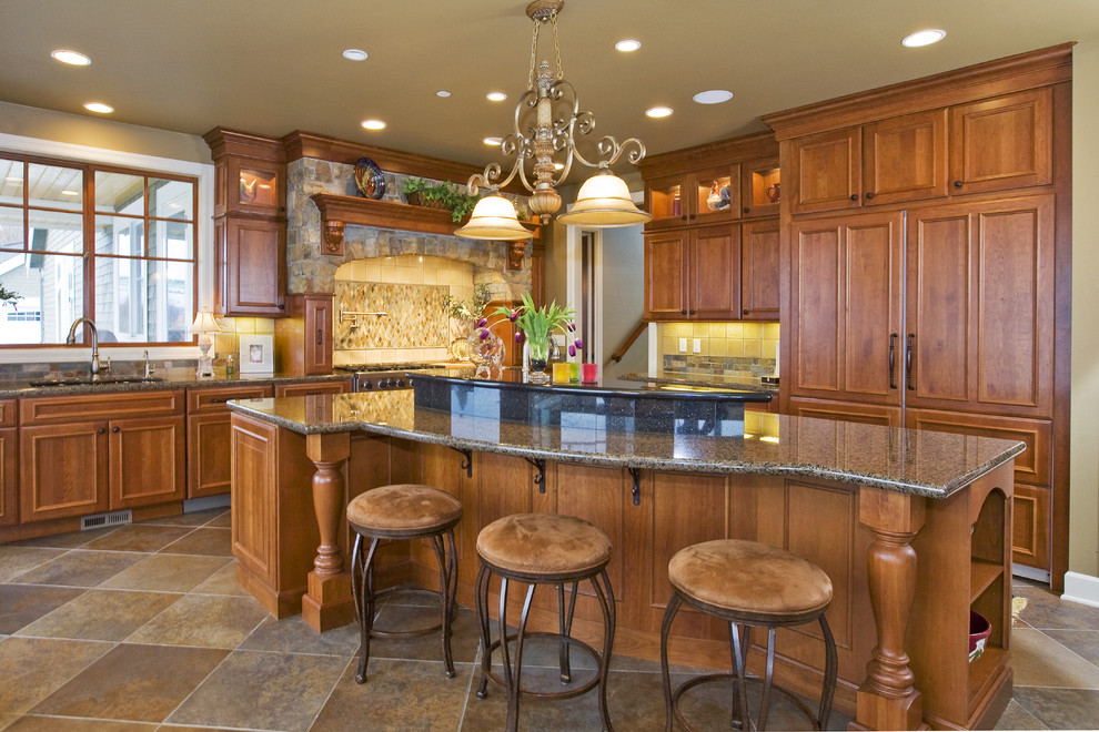 Large eat-in kitchen photo in Minneapolis with an undermount sink, medium tone wood cabinets, multicolored backsplash, stone tile backsplash, paneled appliances and an island