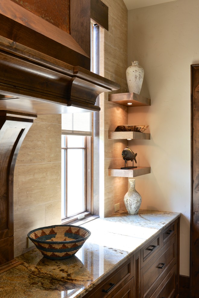 Example of a large transitional u-shaped dark wood floor open concept kitchen design in Dallas with recessed-panel cabinets, medium tone wood cabinets, beige backsplash, stone tile backsplash, an undermount sink, granite countertops, paneled appliances and two islands