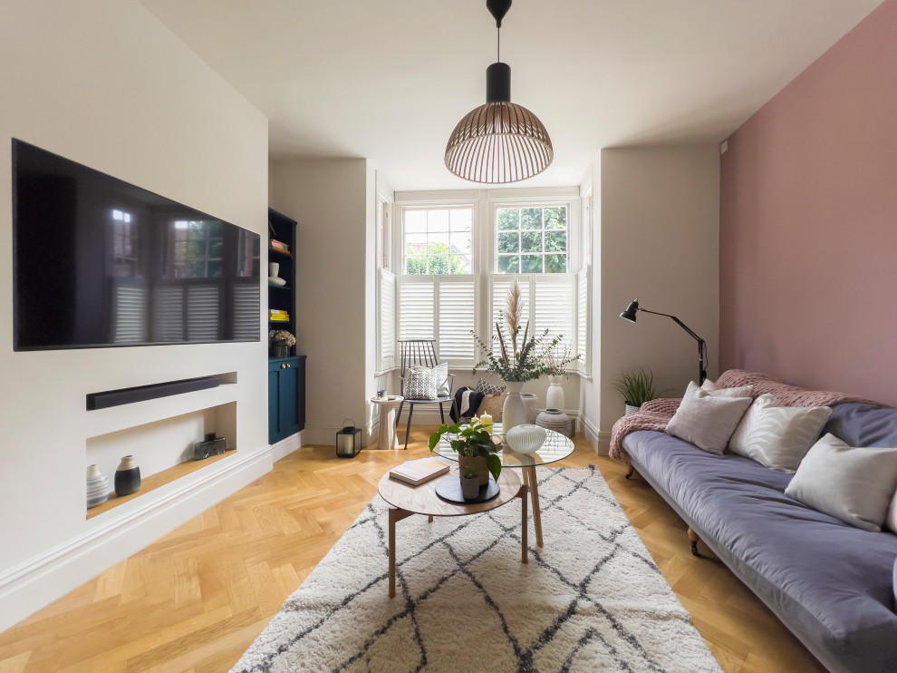 Scandinavian open concept home theatre in Other with a wall-mounted tv.