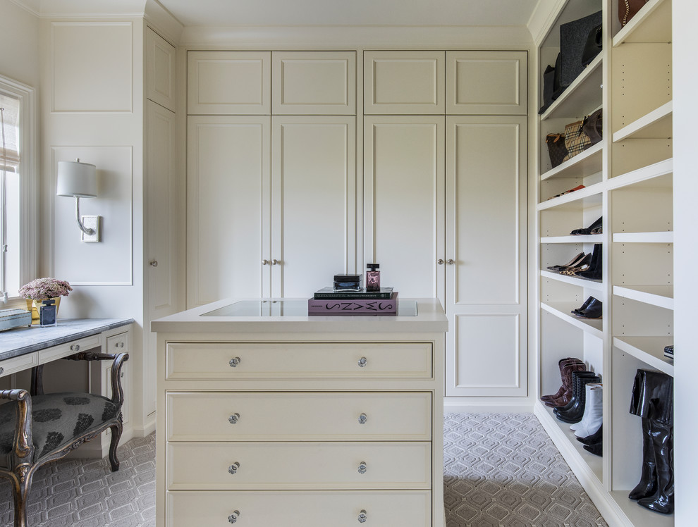 Design ideas for a large traditional gender-neutral dressing room in Portland with beaded inset cabinets, white cabinets, carpet and grey floor.