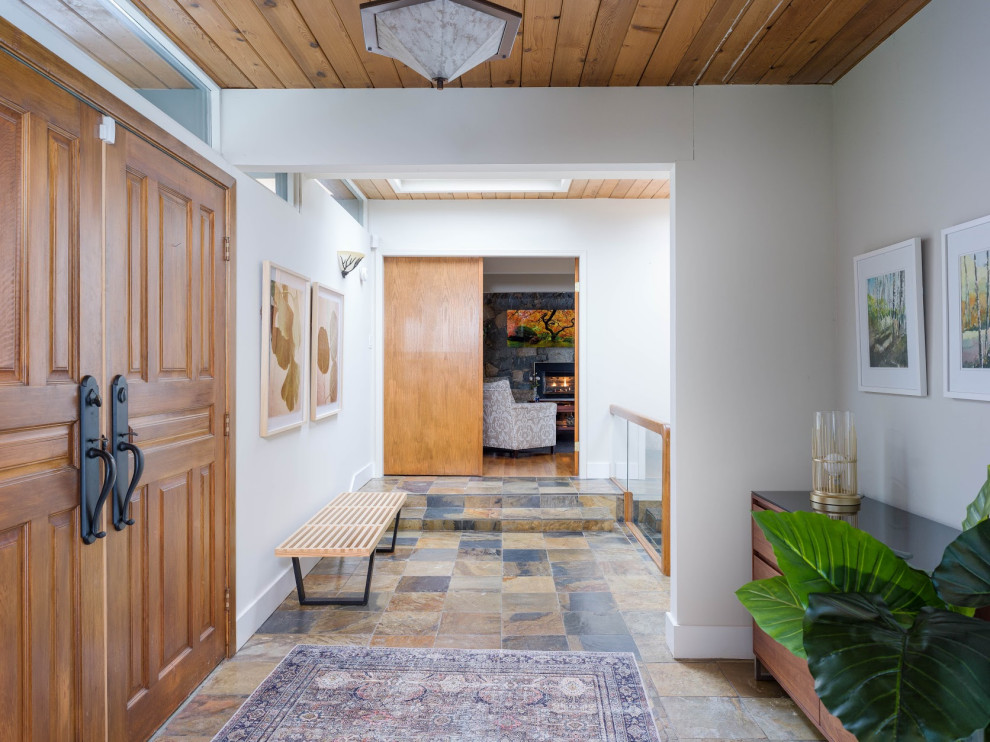 This is an example of a midcentury entryway in Vancouver.