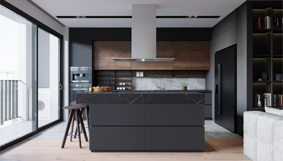 Example of a large trendy l-shaped gray floor eat-in kitchen design in New York with flat-panel cabinets, black cabinets, marble countertops, marble backsplash, black appliances, black countertops, gray backsplash and an island