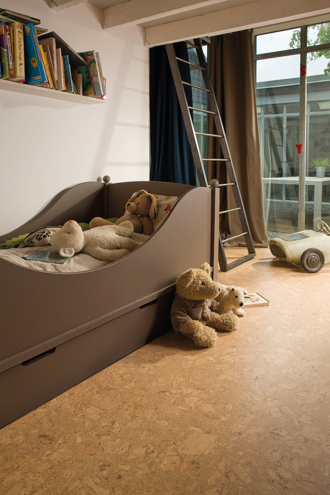 Small contemporary kids' bedroom in Other with white walls, cork floors and brown floor for kids 4-10 years old and boys.