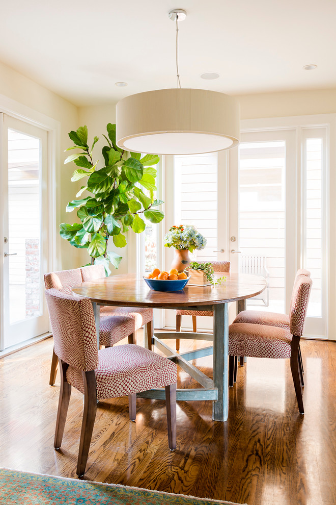 Design ideas for a mid-sized transitional kitchen/dining combo in Los Angeles with beige walls, dark hardwood floors, no fireplace and brown floor.