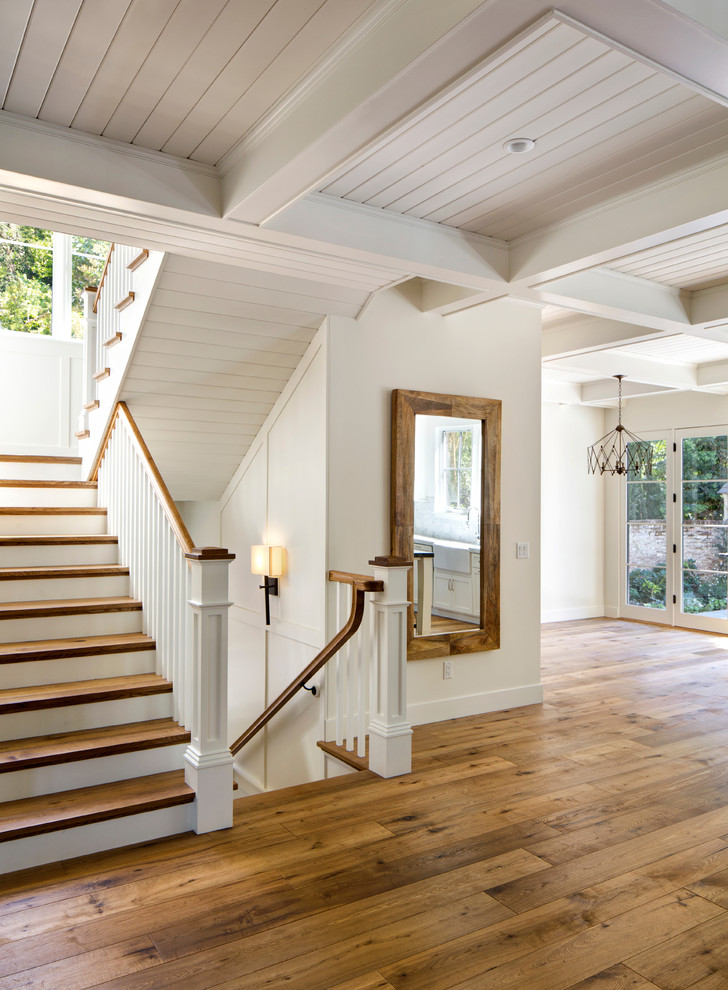 Inspiration for a country wood staircase in San Francisco with painted wood risers.
