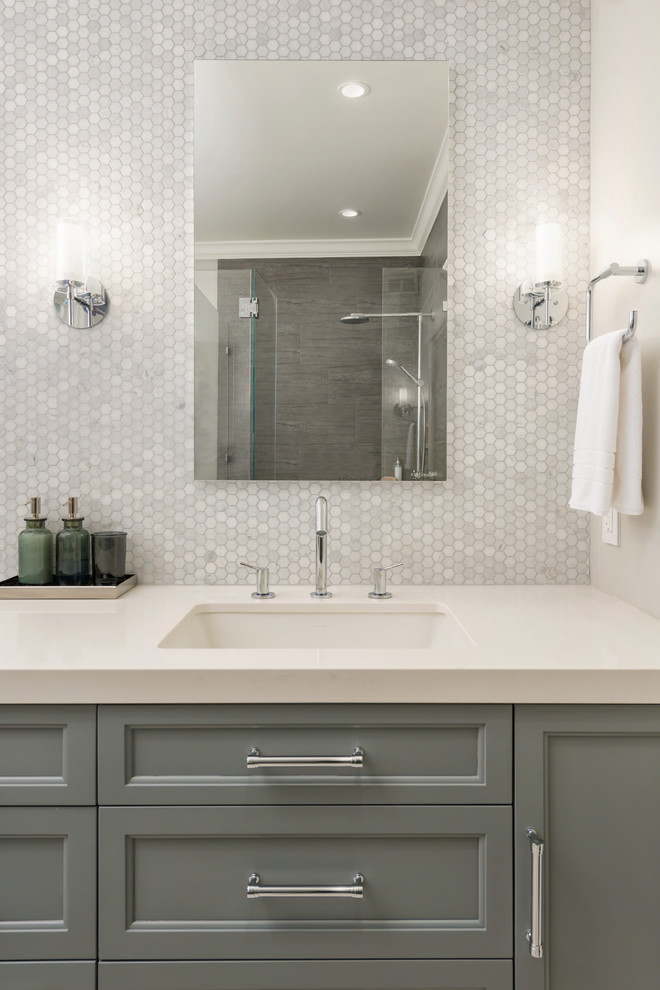 Large transitional master bathroom in San Francisco with beaded inset cabinets, grey cabinets, a curbless shower, a one-piece toilet, gray tile, marble, grey walls, ceramic floors, an undermount sink, engineered quartz benchtops, beige floor and a hinged shower door.