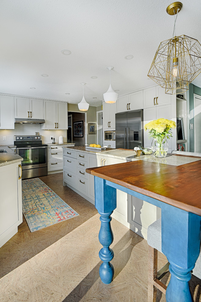 Inspiration for a mid-sized transitional cork floor enclosed kitchen remodel in Ottawa with an undermount sink, shaker cabinets, white cabinets, granite countertops, gray backsplash, ceramic backsplash, stainless steel appliances and an island