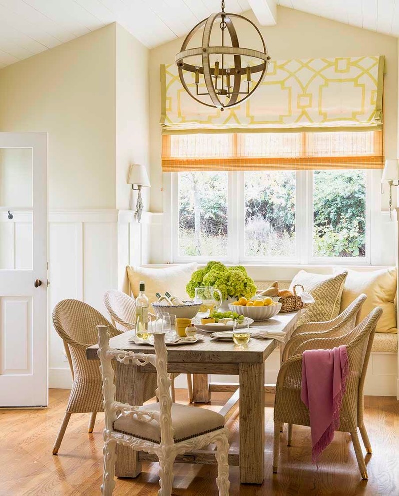 Inspiration for a transitional dining room in San Francisco with yellow walls and medium hardwood floors.