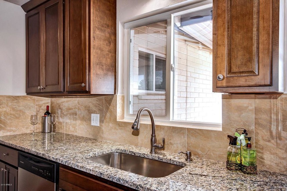 Mid-sized transitional galley terra-cotta tile eat-in kitchen photo in Phoenix with a single-bowl sink, raised-panel cabinets, medium tone wood cabinets, granite countertops, beige backsplash, ceramic backsplash, stainless steel appliances and no island