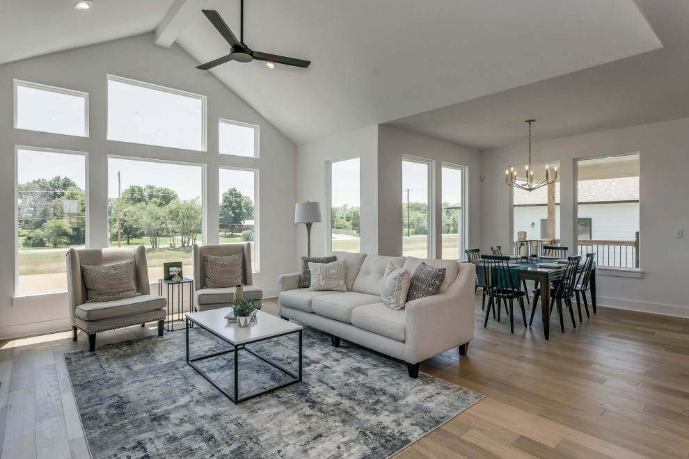 This is an example of a mid-sized country open concept living room in Wichita.