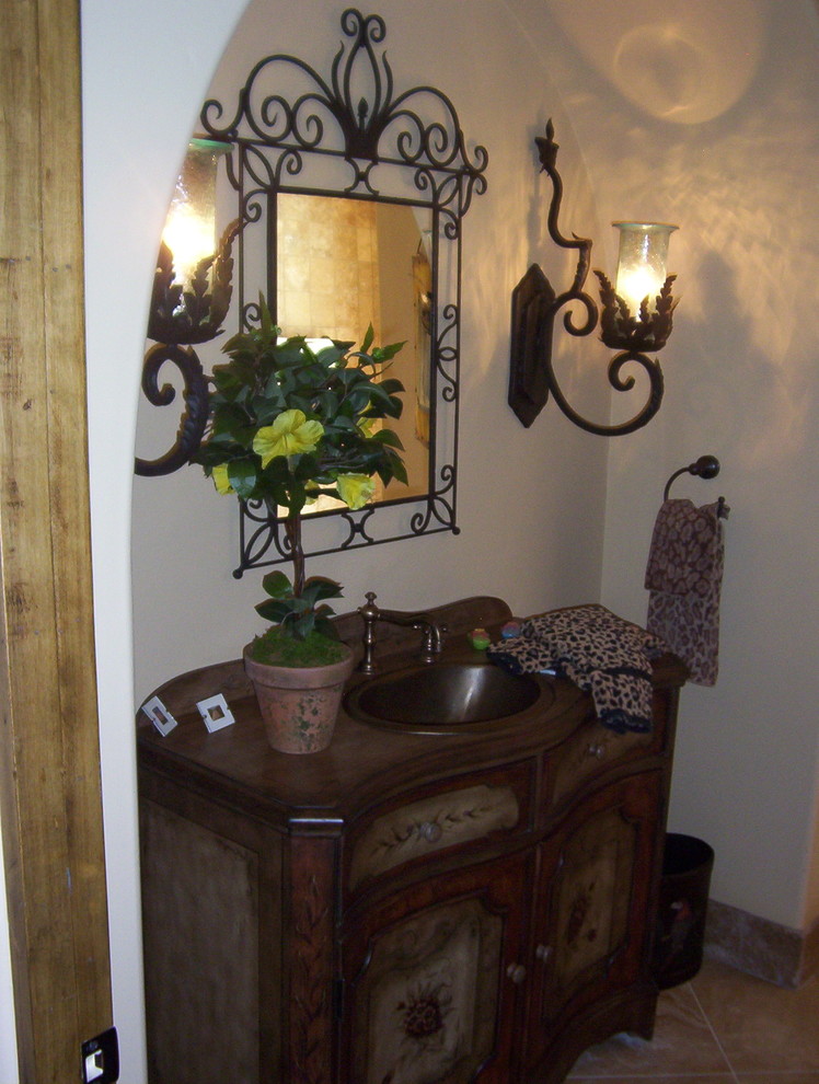 Mountain style 3/4 bathroom photo in Phoenix with furniture-like cabinets, brown cabinets and wood countertops