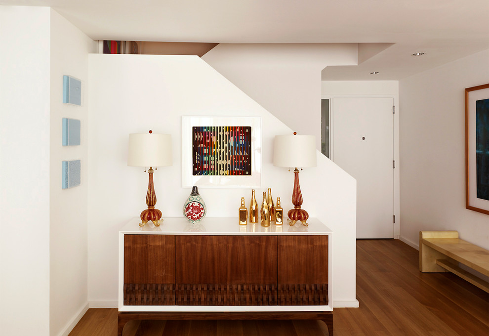 Single front door - mid-sized contemporary light wood floor single front door idea in New York with white walls and a white front door