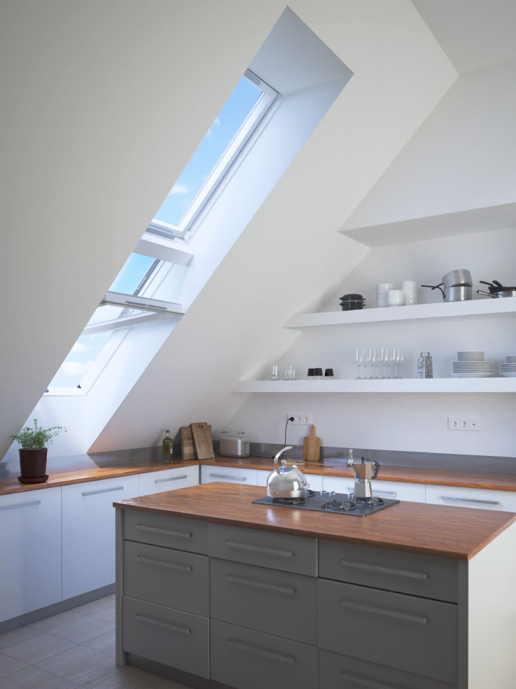 Design ideas for a contemporary l-shaped kitchen in Kent with flat-panel cabinets, white cabinets, wood benchtops, white splashback, with island, beige floor and brown benchtop.
