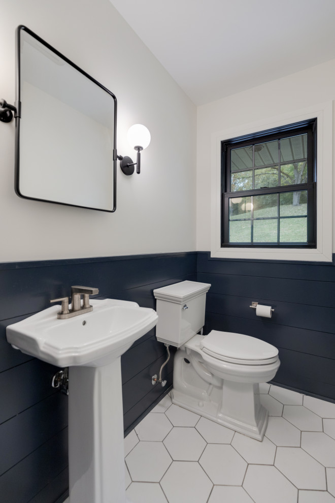 Design ideas for a small cloakroom in Milwaukee with a one-piece toilet, multi-coloured walls, porcelain flooring, a pedestal sink, white floors and tongue and groove walls.