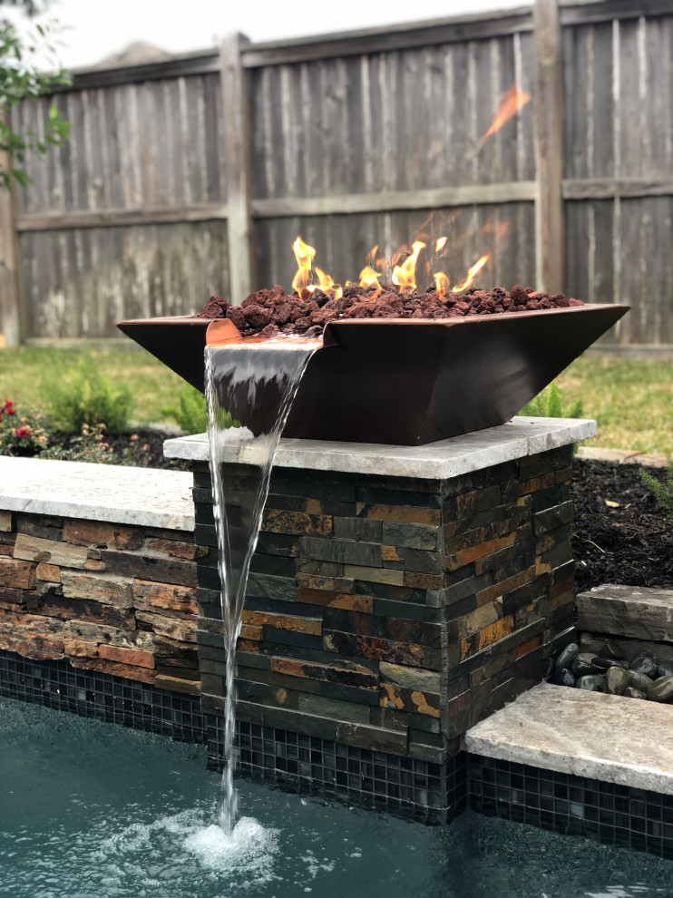 Inspiration for a mid-sized eclectic backyard concrete natural pool fountain remodel in Houston