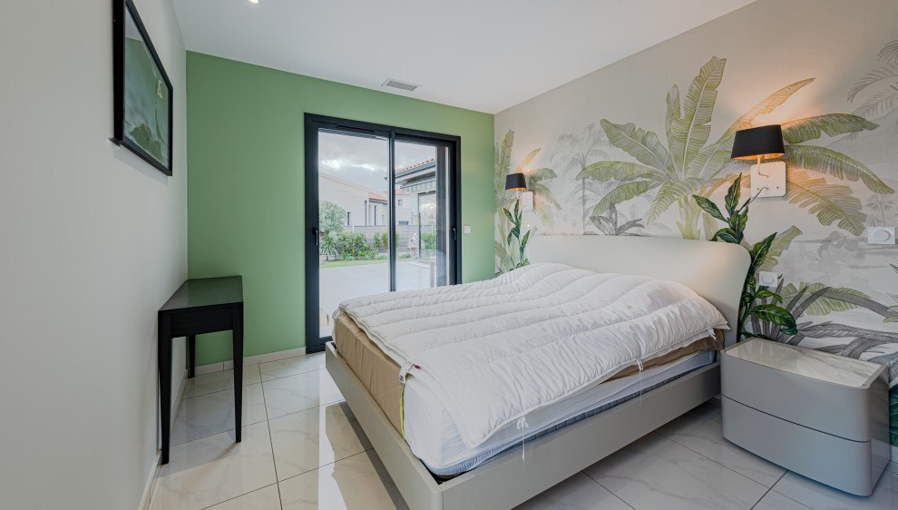 Design ideas for a medium sized modern master bedroom in Toulouse with green walls, ceramic flooring, beige floors and wallpapered walls.