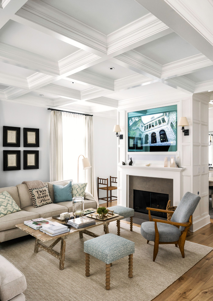Design ideas for a transitional open concept living room in New York with white walls, a standard fireplace, a stone fireplace surround, no tv and beige floor.