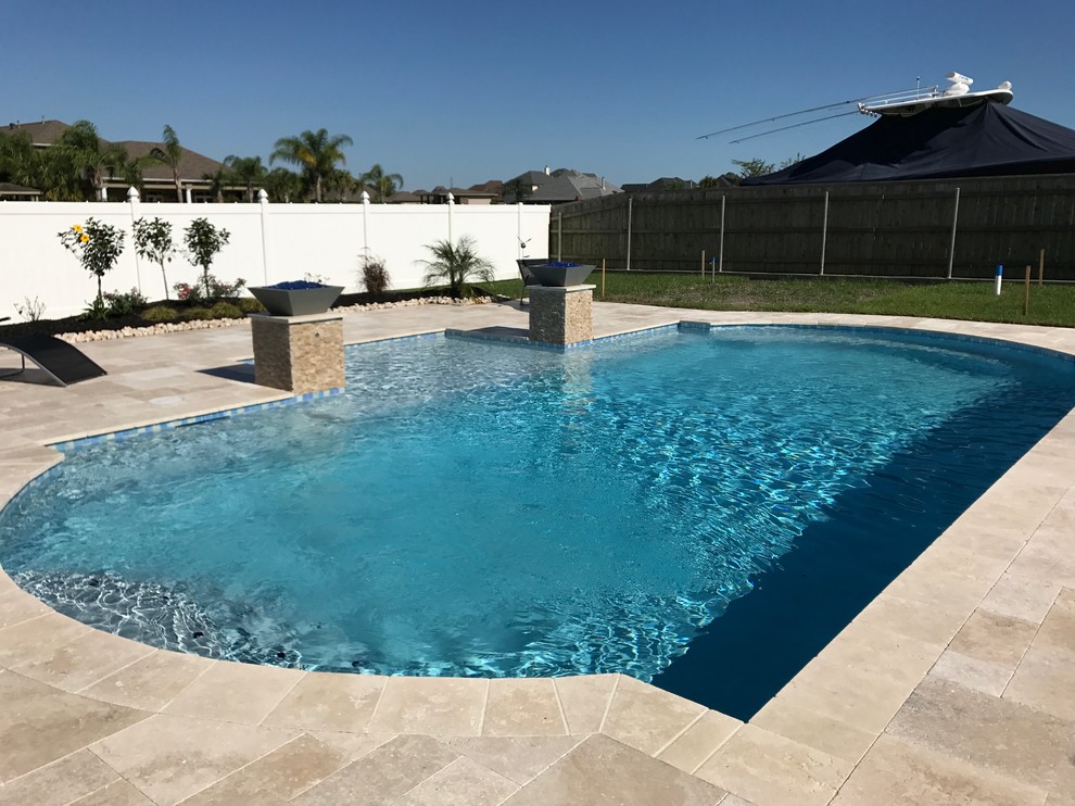 Photo of a mid-sized traditional pool in New Orleans.