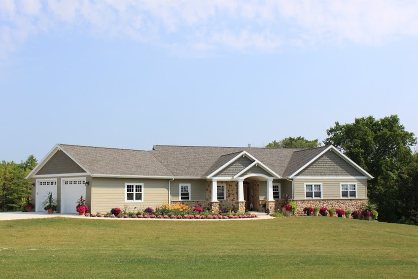 Example of a mid-sized minimalist beige one-story mixed siding exterior home design