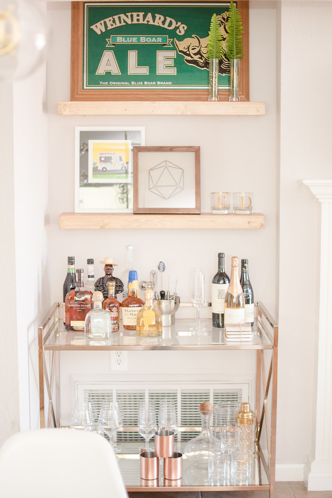 Photo of a mid-sized eclectic bar cart in San Francisco with laminate floors and brown floor.