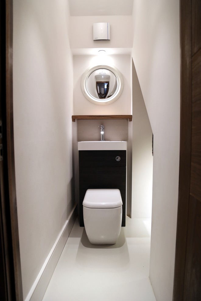 This is an example of a contemporary powder room in Buckinghamshire.