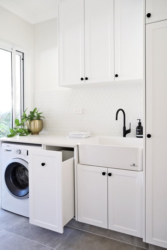 This is an example of a transitional laundry room in Perth.