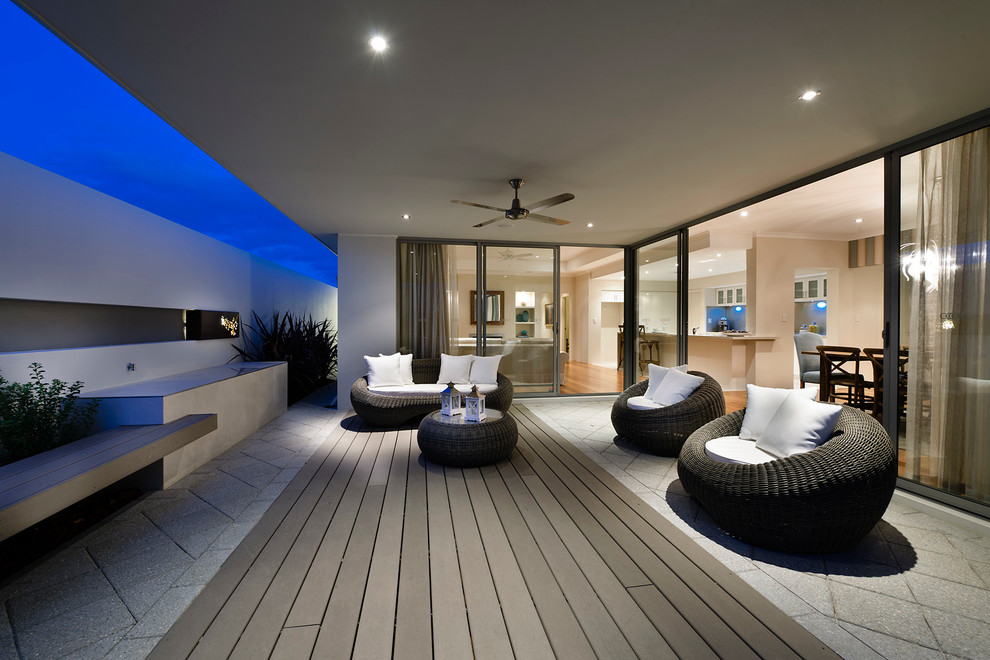 Contemporary patio in Perth with a roof extension.