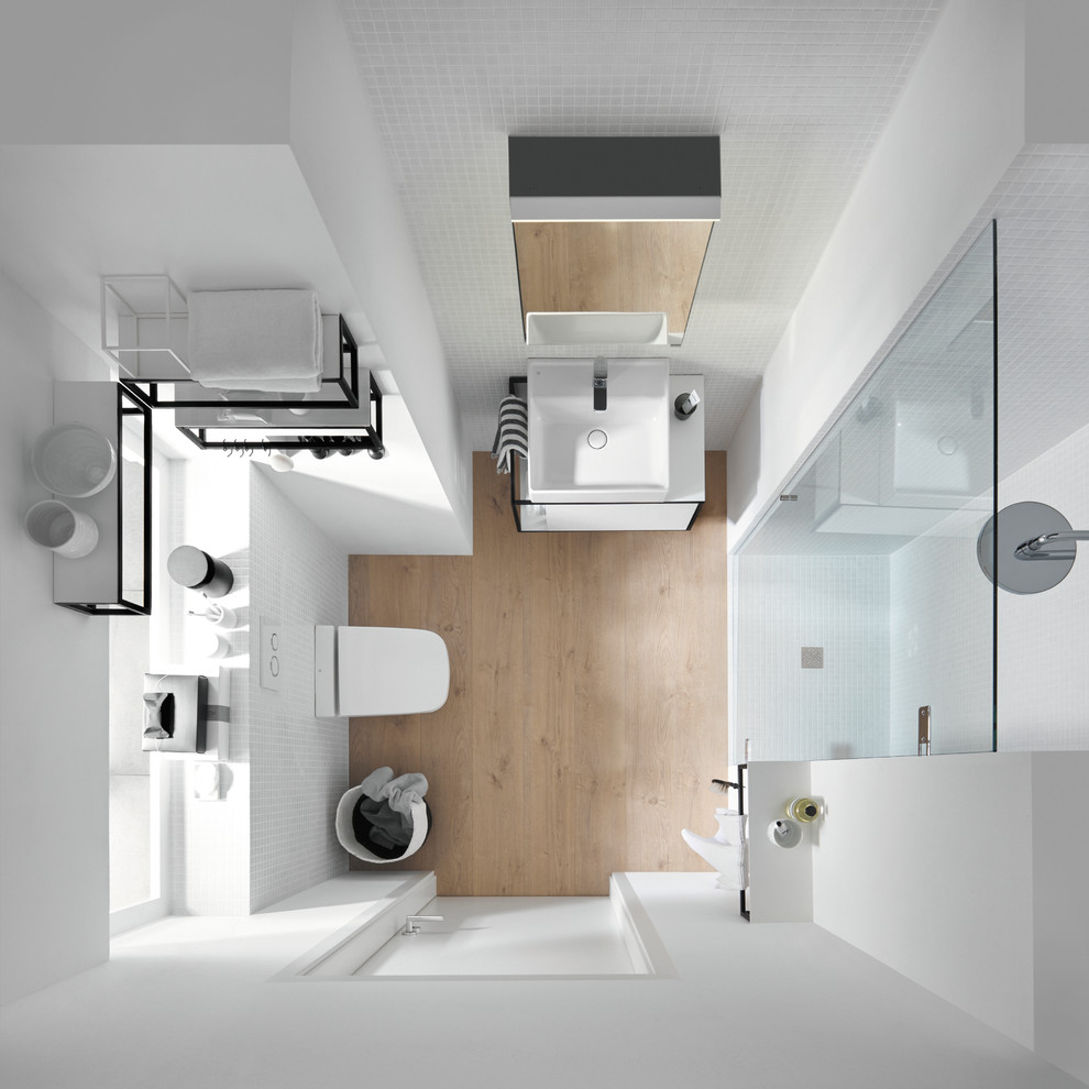 Design ideas for a small contemporary 3/4 bathroom in Nuremberg with flat-panel cabinets, white cabinets, a wall-mount toilet and a vessel sink.