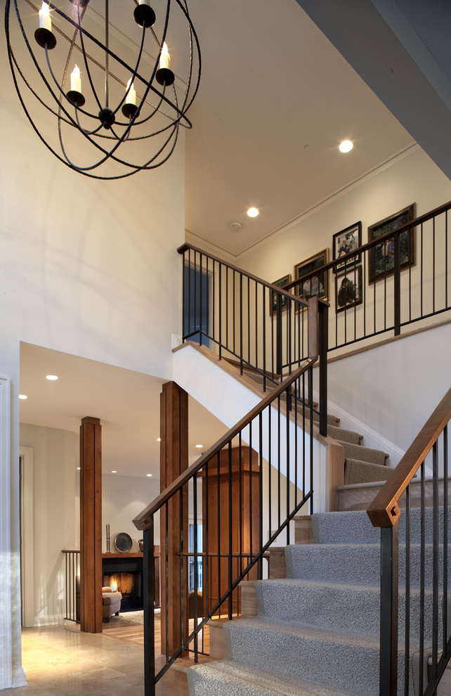Photo of a mid-sized arts and crafts wood l-shaped staircase in Minneapolis with wood risers and mixed railing.