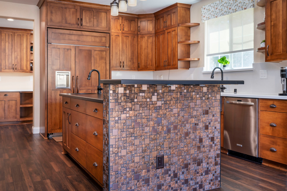 Inspiration for a large craftsman u-shaped vinyl floor and brown floor kitchen remodel in Los Angeles with a triple-bowl sink, raised-panel cabinets, medium tone wood cabinets, quartz countertops, white backsplash, quartz backsplash, stainless steel appliances, an island and multicolored countertops