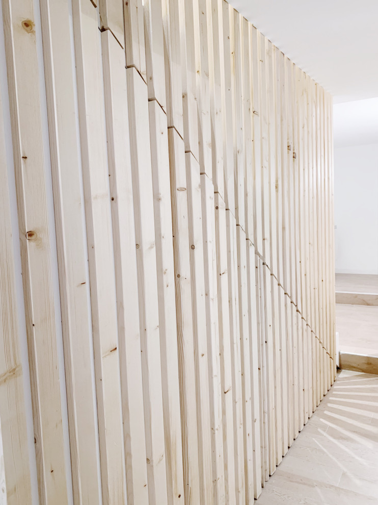 This is an example of a contemporary concrete straight staircase in Marseille with concrete risers and wood railing.