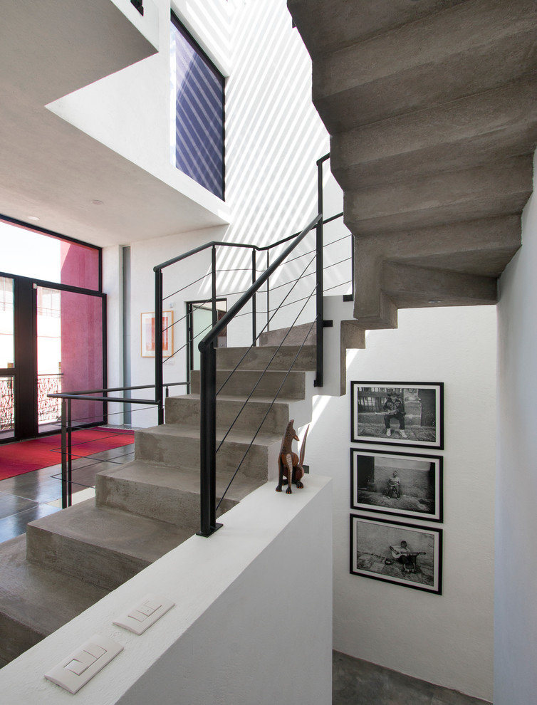 Design ideas for a modern concrete floating staircase in Other with concrete risers.