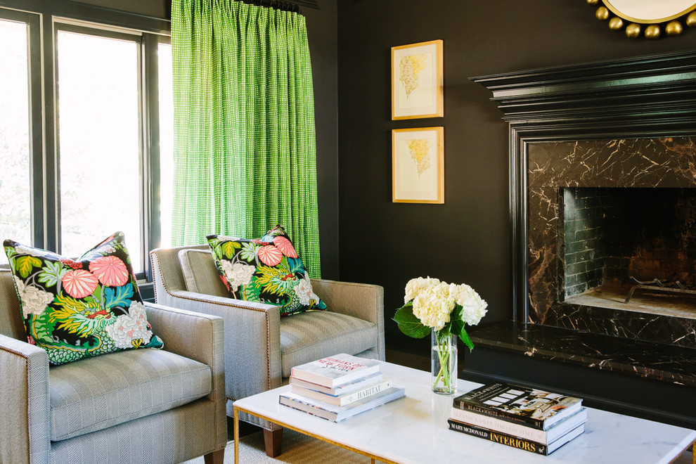 Southill - We honed the existing marble at the fireplace surround and painted the walls a dark color to blend with the fireplace. We brought in color with a velvet sofa, green and white draperies and floral pillows on the chairs.