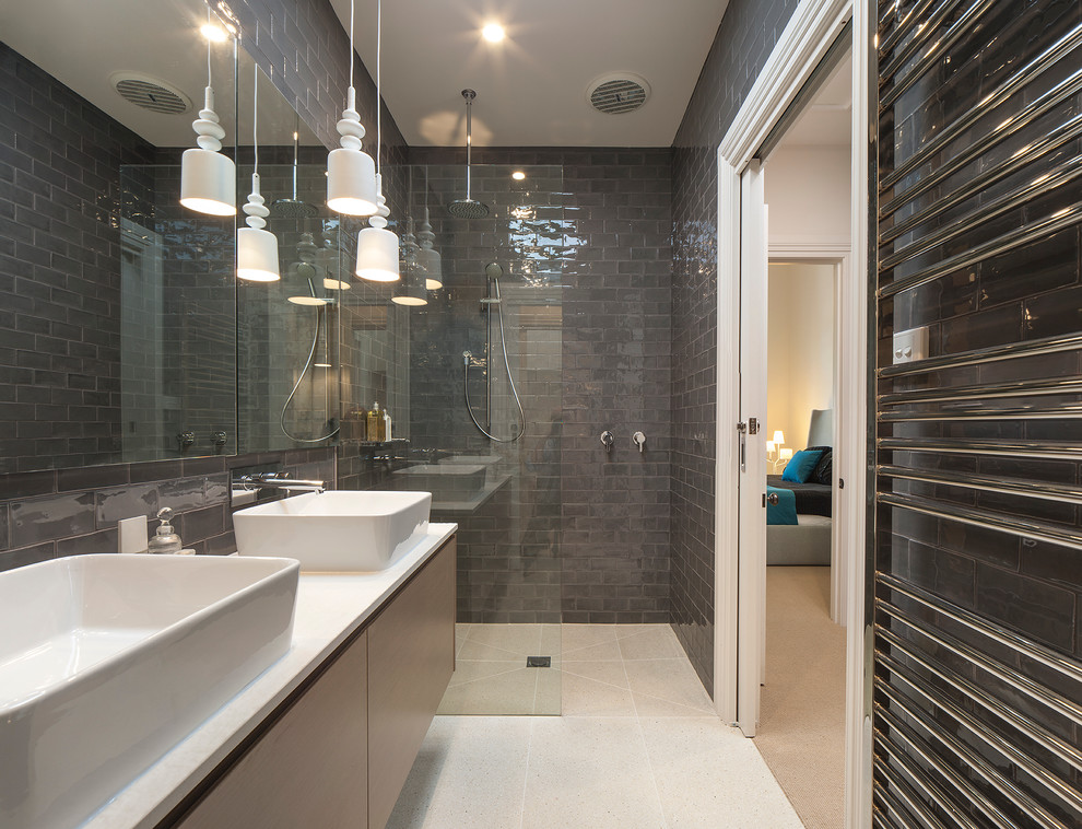 Inspiration for a mid-sized contemporary bathroom in Melbourne with a vessel sink, flat-panel cabinets, light wood cabinets, gray tile and a curbless shower.