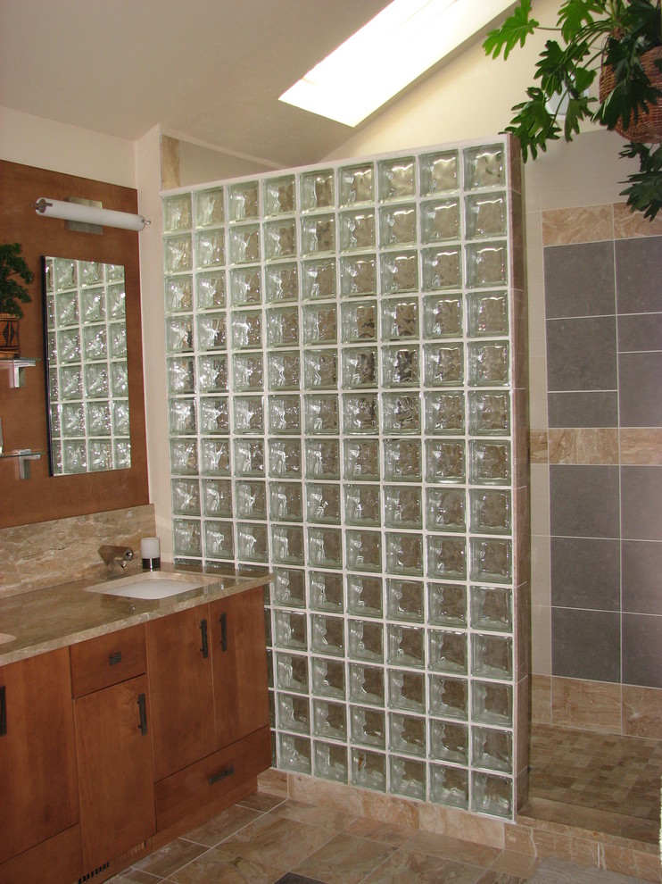 Large transitional master multicolored tile and porcelain tile marble floor and beige floor drop-in bathtub photo in DC Metro with flat-panel cabinets, medium tone wood cabinets, a one-piece toilet, beige walls, an undermount sink and marble countertops