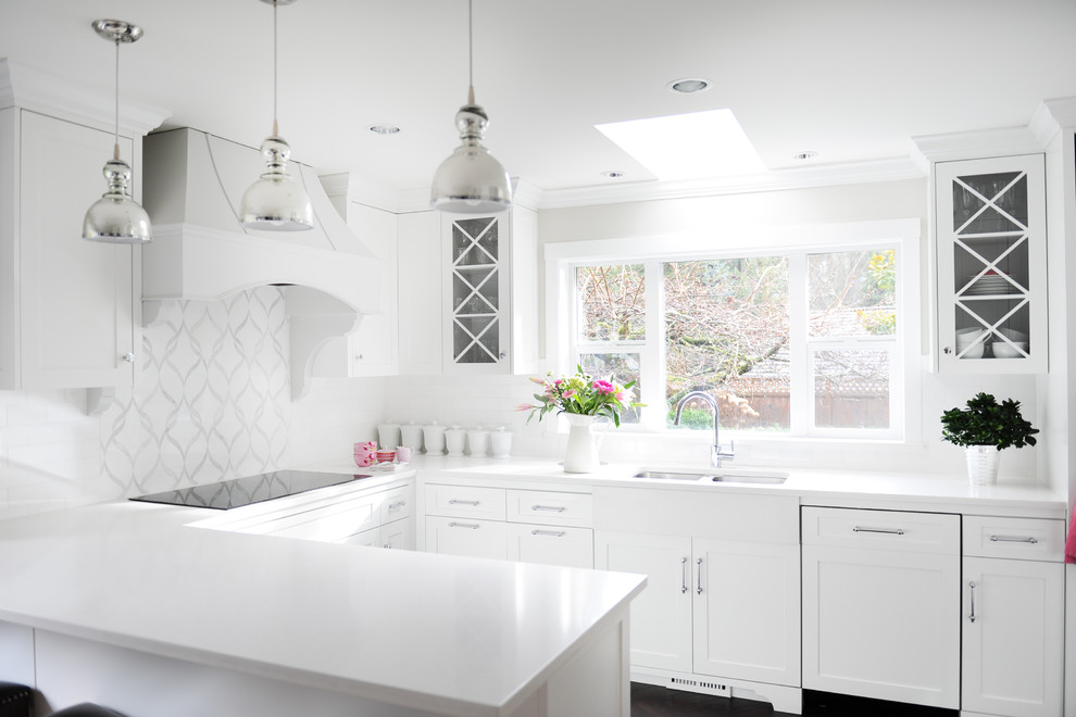 Eat-in kitchen - large transitional u-shaped vinyl floor eat-in kitchen idea in Vancouver with an undermount sink, shaker cabinets, white cabinets, quartz countertops, white backsplash, stone tile backsplash, paneled appliances and a peninsula