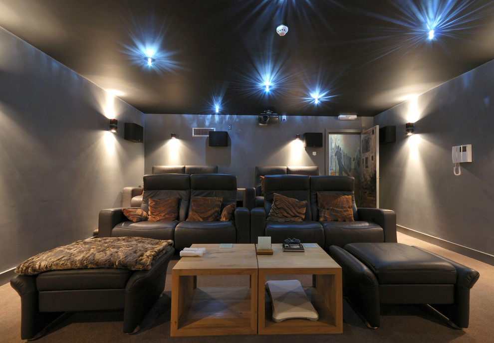 Home theater - contemporary home theater idea in London