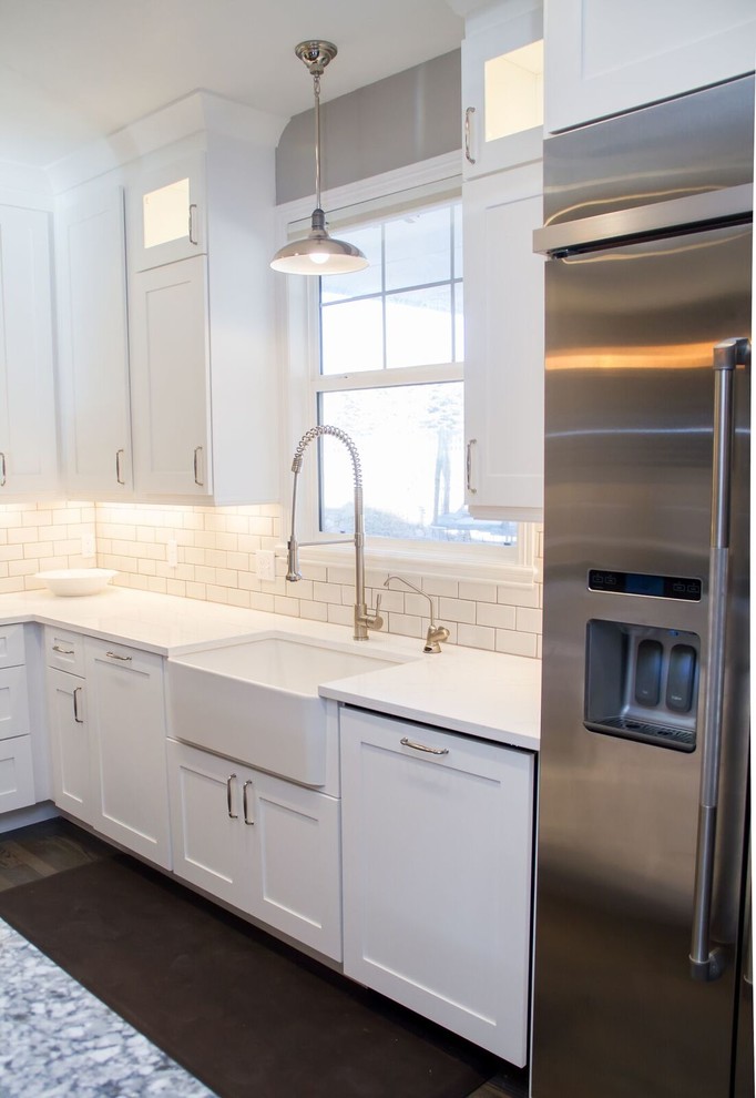 Example of a transitional home design design in Denver