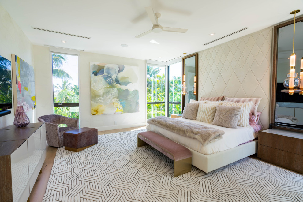 This is an example of a contemporary grey and pink bedroom in Miami.